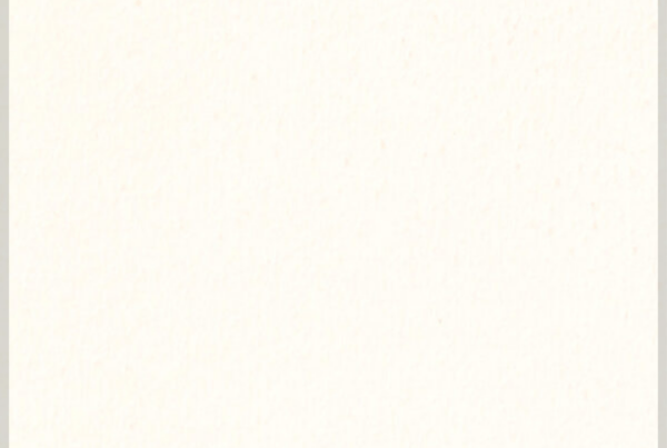 A blank off-white or cream-colored sheet of paper with a subtle texture and faint specks.