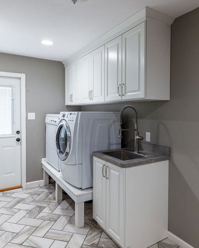 Laundry room white custom cabinetry