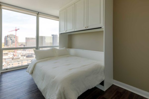 Wall bed with overhead cabinets