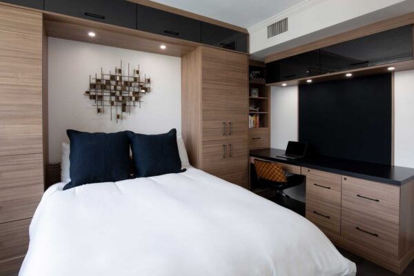 Space-saving wall bed folded out from behind the door, seamlessly blending functionality and design.